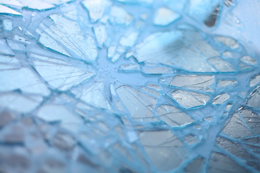 Close-up of a shattered car windshield after an accident