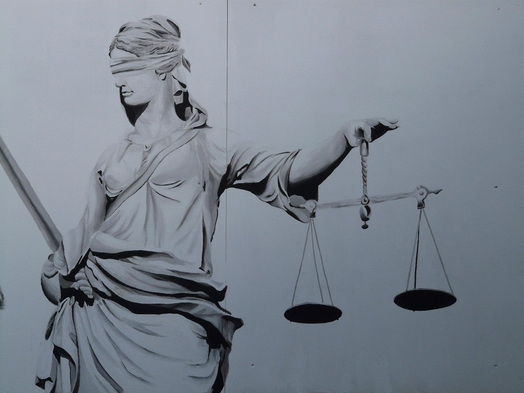 A statue of Lady Justice holding the scales of justice